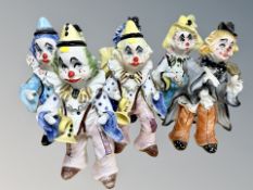 Seven ceramic clown ornaments CONDITION REPORT: Some with damages.