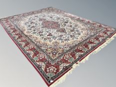 A machine made carpet of Persian Kirman design,