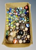A collection of vintage glass and stone marbles