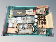 A group of horology items, watch making tools, watch parts,