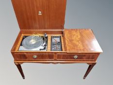A Dynatron record player with Garrard SP-25 MK IV turntable in mahogany cabinet