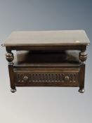 An Ercol stained elm coffee table fitted a drawer,