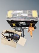 A tool chest and several power tools including drill and angle grinder