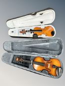 A Primavera 1/2 size student violin together with a further 4/4 size violin in fitted cases