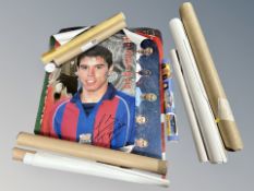 A group of rolled posters, football,
