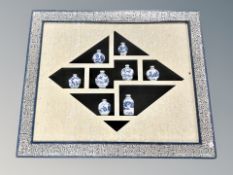 A Chinese framed montage of porcelain vases,