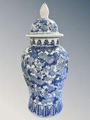 A large Chinese style porcelain blue and white lidded baluster vase,