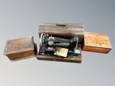 A Singer electric sewing machine with lead and pedal in case together with two antique table boxes