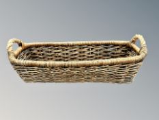 A French wicker twin-handled baguette basket,