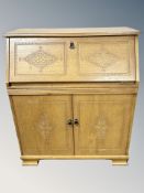 A Newplan Furniture oak bureau,