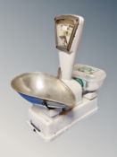 A set of vintage enamelled grocer's weights