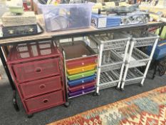 A group of four office filing trolleys