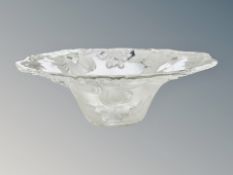 A large pressed glass fruit bowl decorated with fruit,