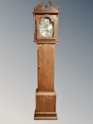 An oak cased Tempus Fugit longcase clock