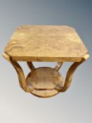 An Art Deco style figured walnut high gloss shaped occasional table width 63 cm