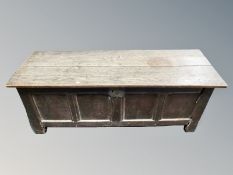 A George III panelled oak coffer,