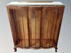 An Art Deco oak serpentine fronted china cabinet,