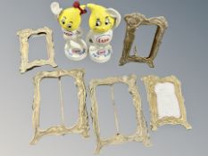 Five brass Art Nouveau style easel picture frames together with two Esso cast iron figures