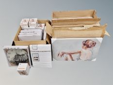 Three boxes of new stock including ten decorative wall canvases, quantity of money banks,