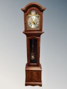 A reproduction granddaughter clock with brass dial signed Thomas Byrne,