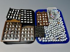 A large quantity of porcelain thimbles and several thimble stands