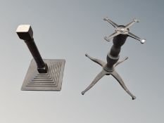 A cast iron table support and one other