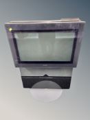 A Bang & Olufsen TV on stand