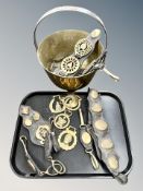 A group of horse brasses and a jam pan