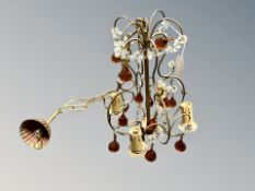 An early 20th century chandelier with amber glass drops