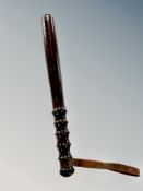 A turned wooden police truncheon,