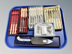 Five boxed sets of cutlery and a further boxed set of four key chain decorations