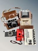 A small group of vintage cameras, Nettar, Olympus trip 35,