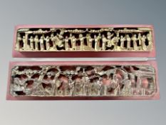 Two early 20th century Chinese carved and gilt temple panels depicting figures in traditional dress,