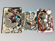 A collection of costume jewellery, teddy bear clock,