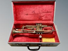 A Corton brass trumpet numbered 411697 in fitted case