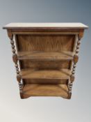An oak four tier bookshelf,