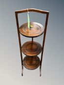 An Edwardian mahogany three tier cake stand
