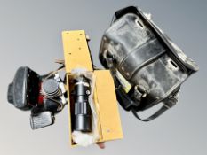 A leather camera case containing Praktica LTL camera, Soligor F=300mm lens,