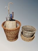 A group of wicker baskets, umbrellas, tennis rackets, framed print,