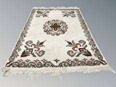 An Eastern deep pile woolen rug 200 cm x 285 cm