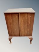 A mahogany double door cabinet,