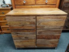 A stained mango wood chest of six drawers,