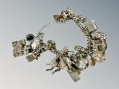 A silver charm bracelet CONDITION REPORT: 76.