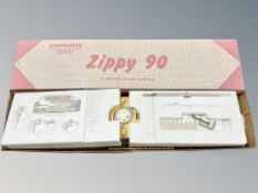 A Knitmaster Zippy 90 knitting machine in box