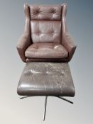 A 20th century Danish brown stitched and button leather swivel armchair on chrome support,
