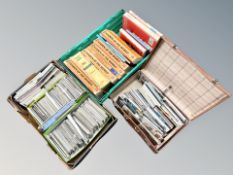 A box and vintage case containing colour postcards,
