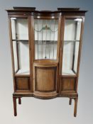 A late Victorian Chinese Chippendale style mahogany display cabinet with concave leaded and stained