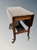 A mahogany drop leaf occasional table