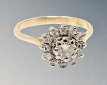 An 18ct gold diamond cluster ring, the central stone approx. 0.