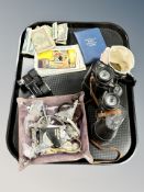 A pair of Pathescope 10 x 50 binoculars, pair of binoculars, humorous postcards, bank notes,